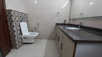 Bathroom in 3 BHK Apartment at Defence Colony – for Rent