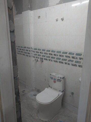 Bathroom in 3 BHK Apartment at Raj Nagar Extension – for Sale
