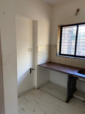Kitchen in 1 BHK Apartment at Royal Palms Garden View, Goregaon East – for Rent