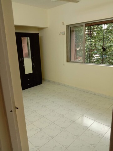 Bedroom in 1 BHK Apartment at Rutu Enclave, Kasarvadavali – for Rent