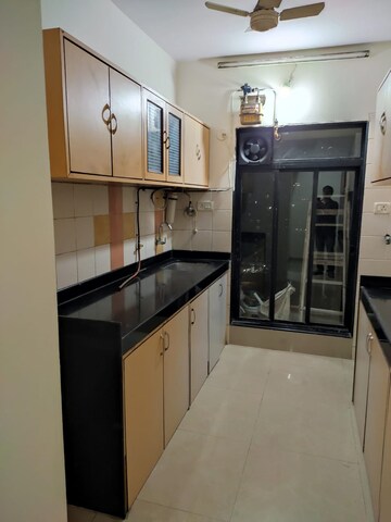 Kitchen in 2 BHK Apartment at Sai Gunina Apartment, Sanpada – for Rent