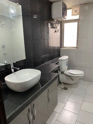 Bathroom in 3 BHK Apartment at Mahagun Mezzaria, Sector 78 – for Rent