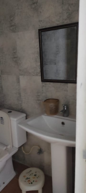 Bathroom in Studio Apartment at Sushma Elite Cross, Dhakoli Village – for Rent