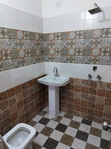 Bathroom in 2 BHK Apartment at Shri Devaji Residency, Dhakoli Village – for Rent