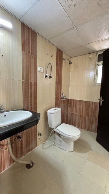 Bathroom in 3 BHK Apartment at Mahagun Medalleo, Sector 107 – for Sale