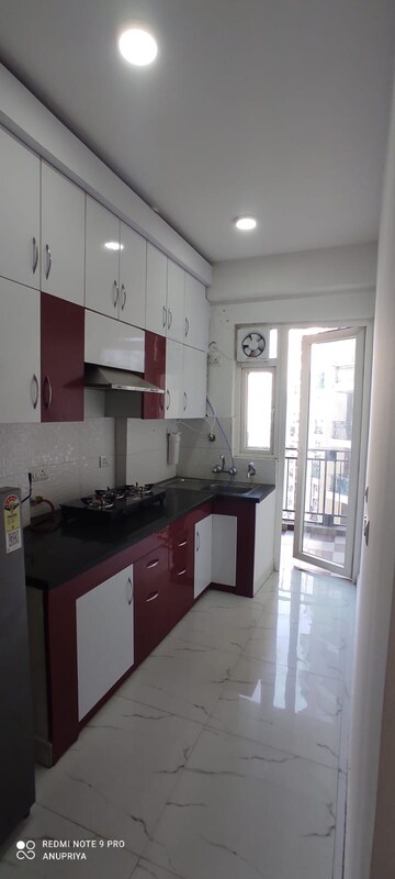 Kitchen in 2 BHK Apartment at Casa Woodstock, Sector 16c Greater Noida – for Rent