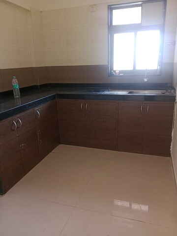 Kitchen in 1 BHK Apartment at Raunak Delight, Owale – for Rent