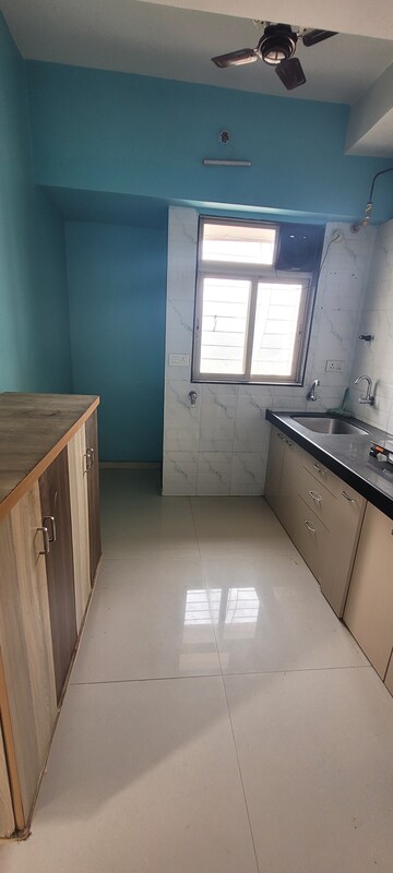 Kitchen in 1 BHK Apartment at Cosmos Lounge, Manpada – for Rent