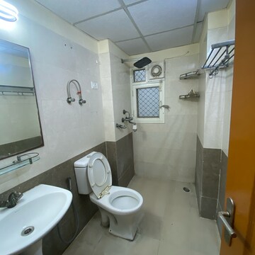 Bathroom in 3.5 BHK Apartment at Aims Golf City, Noida Central – for Rent
