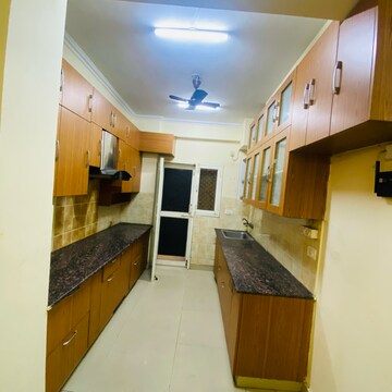Kitchen in 3.5 BHK Apartment at Aims Golf City, Noida Central – for Rent