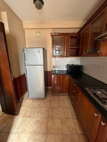 Kitchen in 3.5 BHK Apartment at Unitech Palms, South City 1 – for Rent