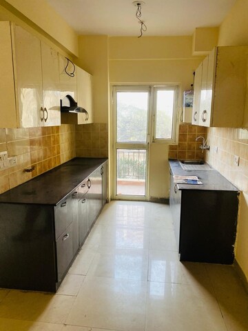 Kitchen in 1.5 BHK Apartment at Ramesh Nagar – for Rent