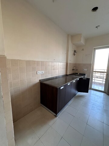 Kitchen in 4 BHK Apartment at Satya The Hermitage, Sector 103 – for Rent