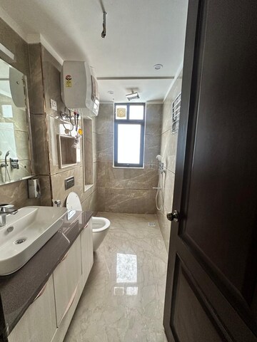 Bathroom in 4 BHK Apartment at Anand Niketan – for Rent