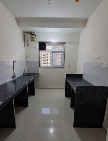 Kitchen in 2 BHK Apartment at Ashar Axis, Majiwada – for Rent