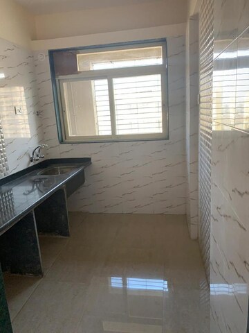 Kitchen in 2 BHK Apartment at Mohan Willows, Badlapur East – for Rent