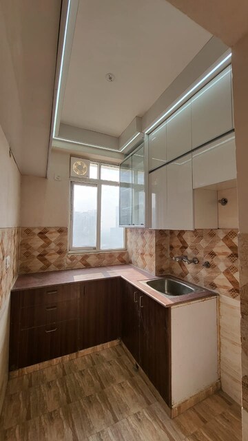 Kitchen in 2.5 BHK Apartment at Amrapali Golf Homes, Sector 4, Greater Noida – for Rent