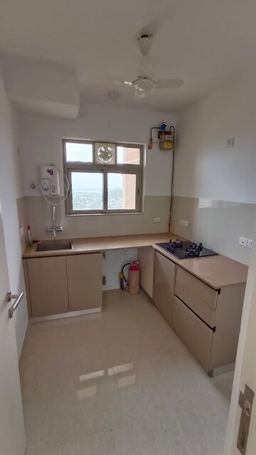 Kitchen in 1 BHK Apartment at Hiranandani Estate Solitaire C, Ghodbunder Road – for Rent