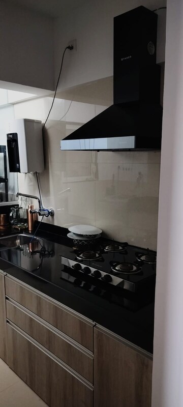 Kitchen in 2 BHK Apartment at Shree Venkatesh Graffiti Glover, Keshav Nagar – for Rent