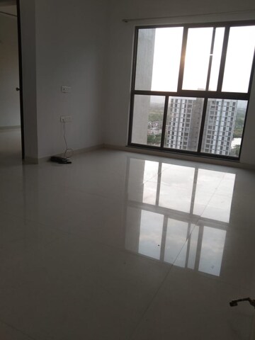 Living Room in 1 BHK Apartment at Lodha Palava Downtown, Dombivli East – for Rent