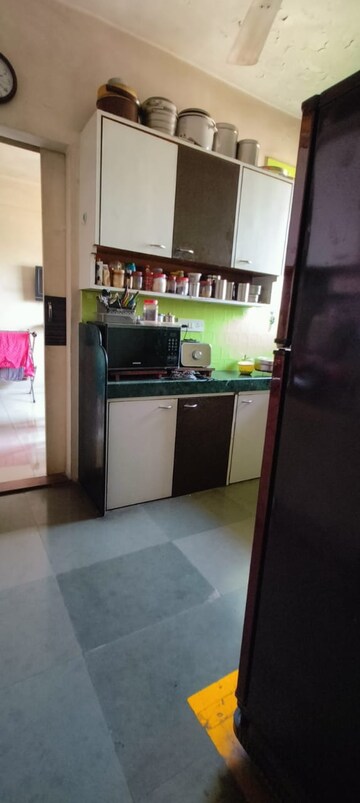 Kitchen in 1 BHK Apartment at Chandravadan CHS, Ganeshwadi – for Sale