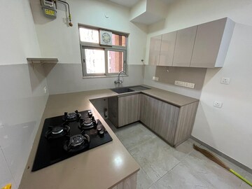 Kitchen in 1 BHK Apartment at Hiranandani Woodstock, Ghodbunder Road – for Rent
