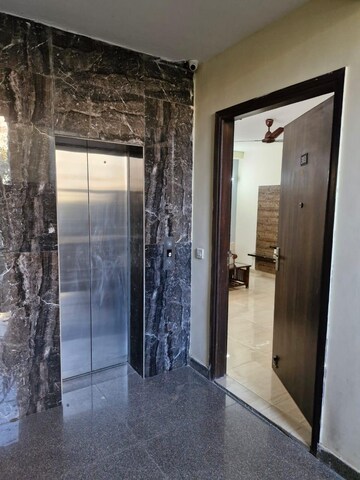 Building Lobby in 1 RK Apartment at Ansal Sushant Lok I, Sector 43 – for Rent