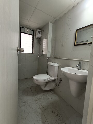 Bathroom in 3 BHK Apartment at Runwal Gardens, Dombivli East – for Rent