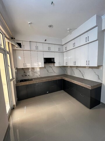 Kitchen in 2.5 BHK Apartment at Mahagun Mywoods II, Sector 16c Greater Noida – for Rent