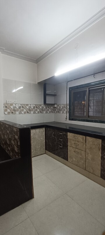 Kitchen in 1.5 BHK Apartment at Jag Shanti Niketan, Mira Road – for Rent