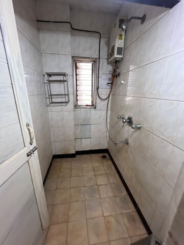 Bathroom in 1 BHK Apartment at Brahmand CHS, Brahmand – for Rent