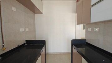 Kitchen in 2 BHK Apartment at Paradigm Ananda Residency, Borivali West – for Sale