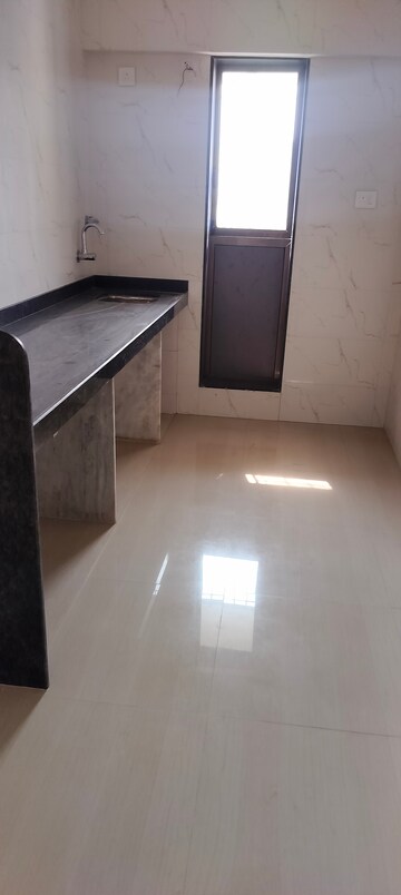 Kitchen in 2 BHK Apartment at Nirmaan Shivneri CHS, Andheri West – for Sale