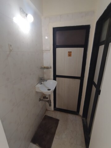 Attached Bathroom in 1 BHK Apartment at Parijat Gardens Marigold CHS, Kasarvadavali – for Sale