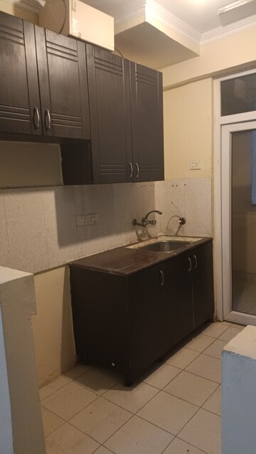 Kitchen in 2 BHK Apartment at Amrapali Silicon City, Sector 76 – for Rent