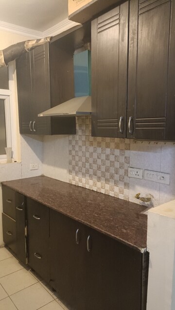 Kitchen in 2 BHK Apartment at Amrapali Silicon City, Sector 76 – for Rent