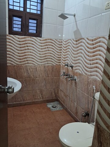 Bathroom in 3 BHK Apartment at Mahagun Mezzaria, Sector 78 – for Rent