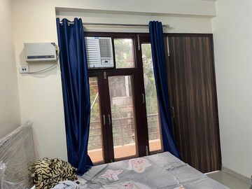 Bedroom in Studio Builder Floor at Ansal Sushant Lok I, Sector 43 – for Rent