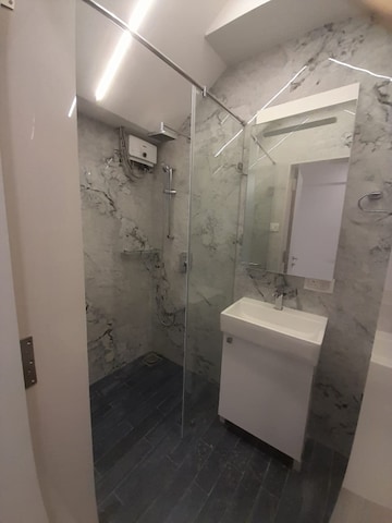Bathroom in 1 BHK Apartment at Peddar Road – for Rent