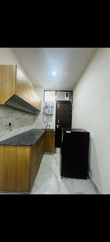 Kitchen in Studio Builder Floor at Ansal Sushant Lok I, Sector 43 – for Rent