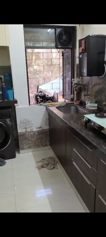 Kitchen in 1 BHK Apartment at Shalmali Cooperative Housing Society, Vasant Vihar – for Sale