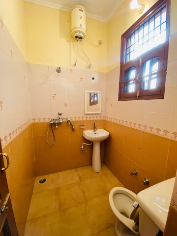 Bathroom in 2 BHK Apartment at Sunny Enclave – for Rent