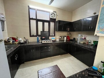 Kitchen in 2 BHK Apartment at Sarvodya Enclave – for Rent