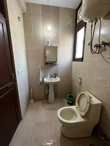Bathroom in 2 BHK Apartment at Sarvodya Enclave – for Rent