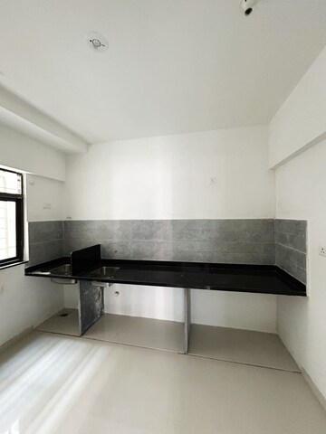 Kitchen in 2 BHK Apartment at Roshan Milestone, Tathawade – for Sale