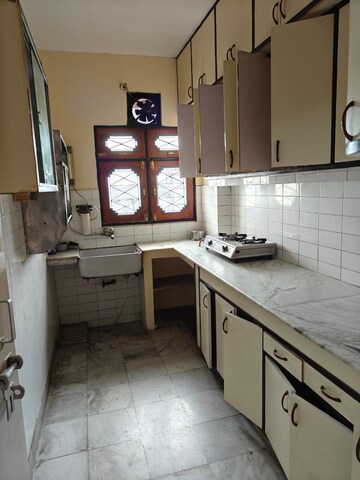 Kitchen in 2 BHK Apartment at Vikas Nagar – for Rent
