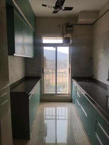Kitchen in 2 BHK Apartment at Vihang Vermont, Ghodbunder Road – for Rent