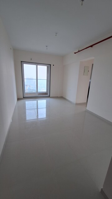 Living Room in 1 BHK Apartment at Ashar Axis, Majiwada – for Rent
