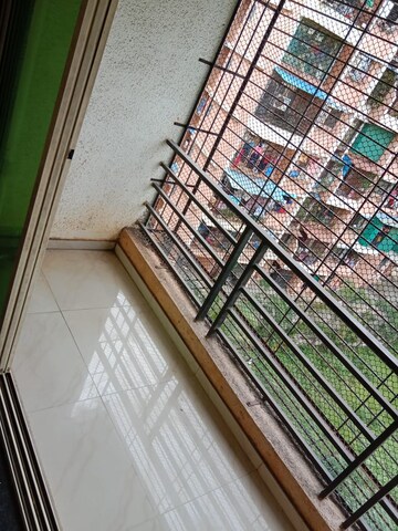 Balcony in 2 BHK Apartment at Kalp Nisarg Phase I, Shirgaon – for Rent