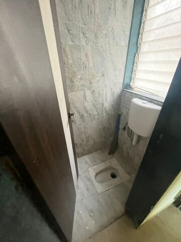 Bathroom in 1 BHK Apartment at Mohan Willows, Badlapur East – for Rent